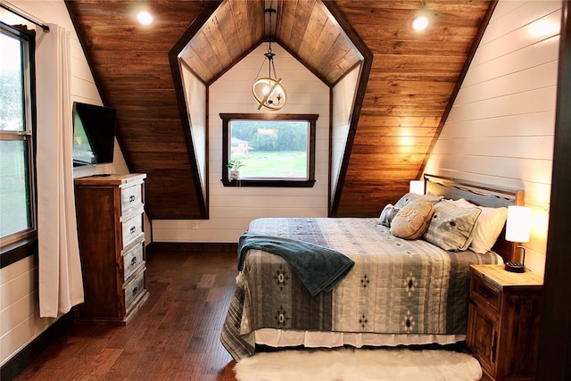 bedroom with dark hardwood / wood-style flooring, wooden walls, vaulted ceiling, and wooden ceiling