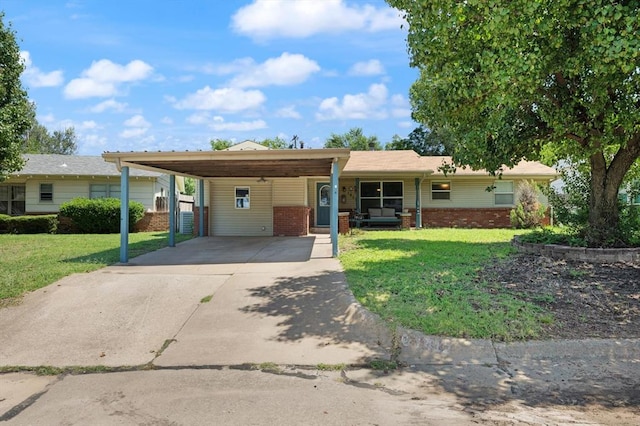 ranch-style home with a carport and a front lawn