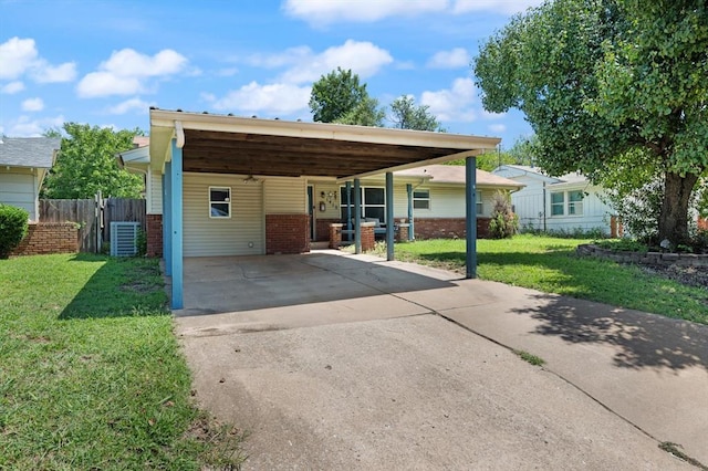 view of front of property with a front yard and a carport