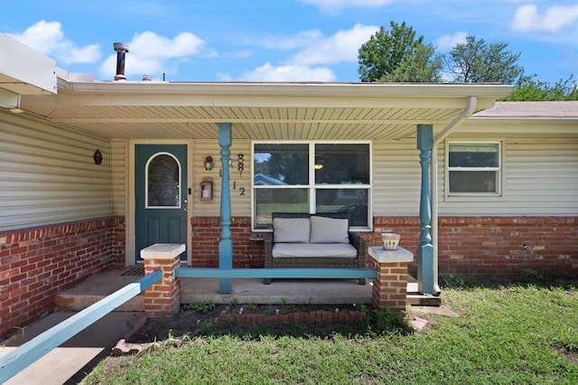 doorway to property featuring a porch