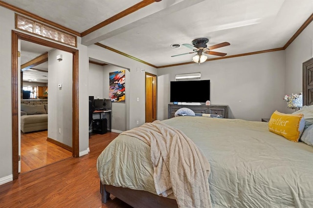 bedroom with hardwood / wood-style floors, ceiling fan, and ornamental molding