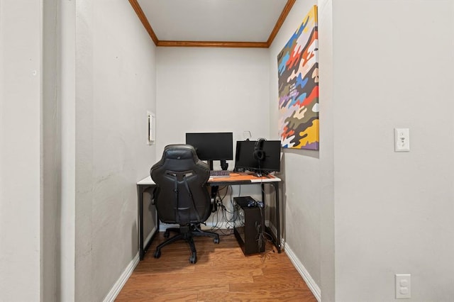 office area with hardwood / wood-style floors and crown molding