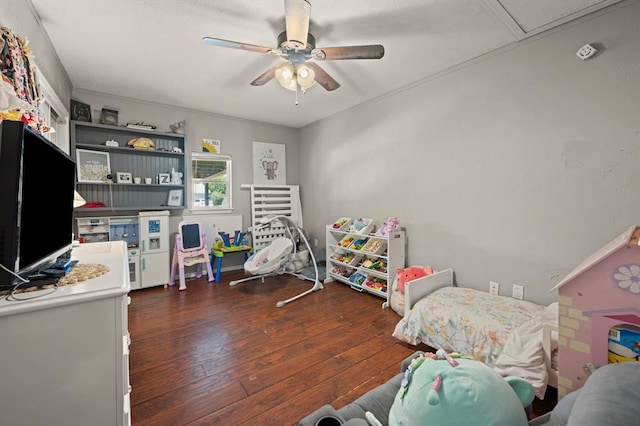 game room featuring ceiling fan and dark wood-type flooring