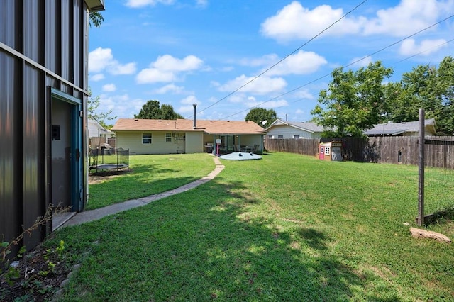 view of yard featuring a trampoline