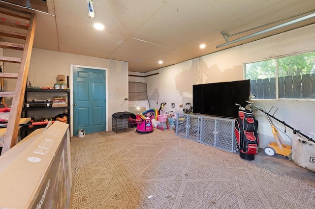 recreation room with concrete flooring