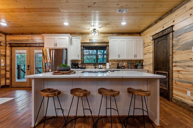 453 Bear Pine Trl, Broken Bow, OK 74728 - kitchen with stainless steel fridge with ice dispenser, wooden ceiling, white cabinets, dark wood finished floors, and a sink