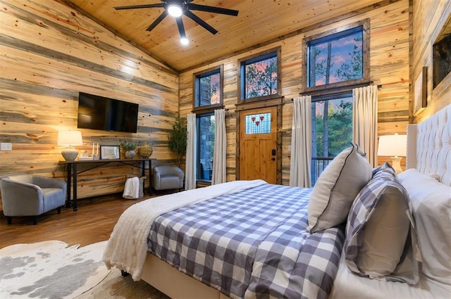 bedroom featuring high vaulted ceiling, wooden walls, hardwood / wood-style flooring, access to outside, and wood ceiling