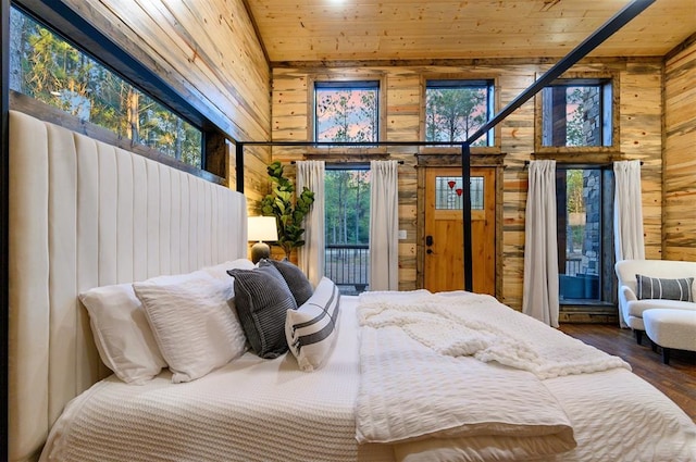 453 Bear Pine Trl, Broken Bow, OK 74728 - bedroom with wood walls, wooden ceiling, wood finished floors, access to exterior, and a towering ceiling