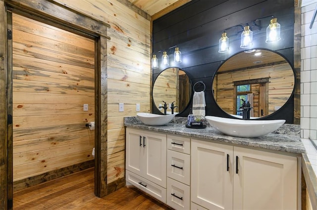 453 Bear Pine Trl, Broken Bow, OK 74728 - full bath featuring wood walls, double vanity, and wood finished floors