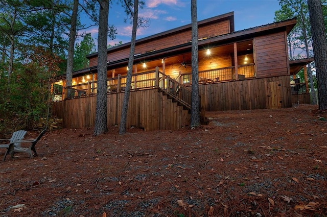 exterior space featuring ceiling fan