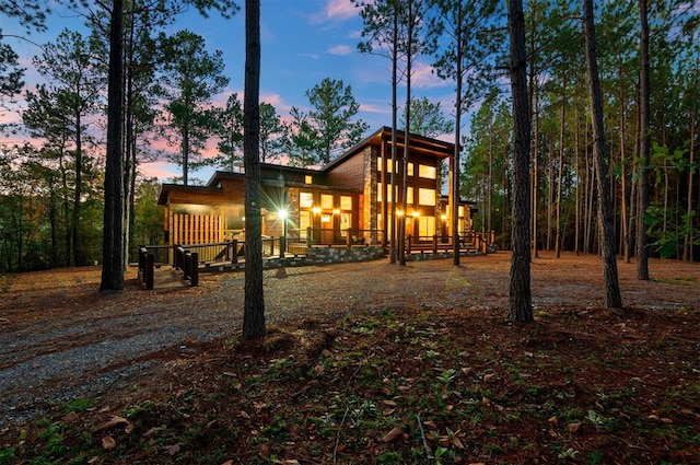 view of back house at dusk