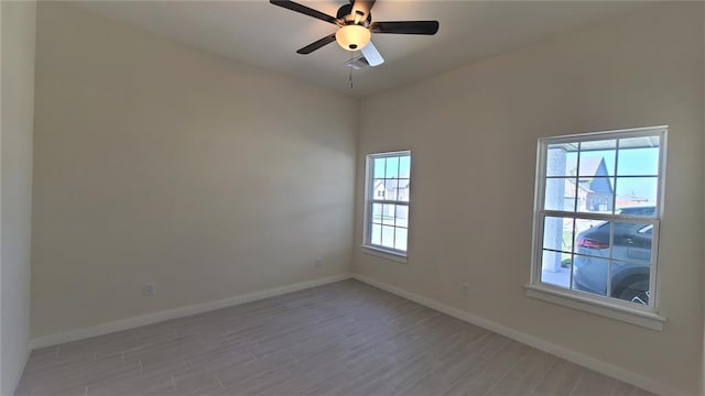 unfurnished room featuring light hardwood / wood-style flooring and ceiling fan