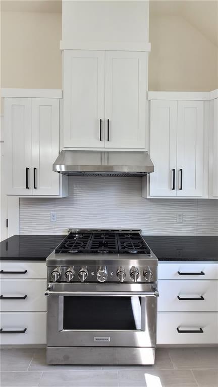 108 Tralee Ct, Yukon, OK 73099 - kitchen featuring high end range, white cabinets, backsplash, under cabinet range hood, and dark countertops