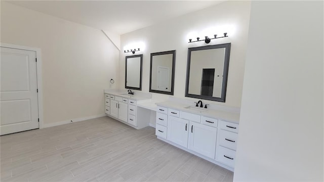 bathroom featuring hardwood / wood-style floors and vanity