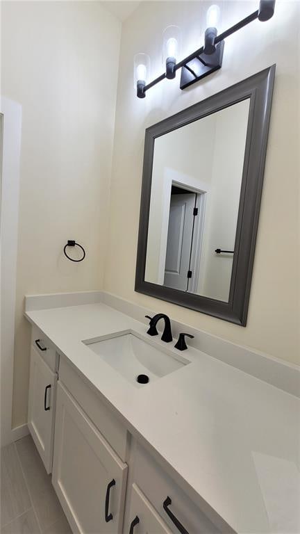 bathroom with tile patterned floors and vanity