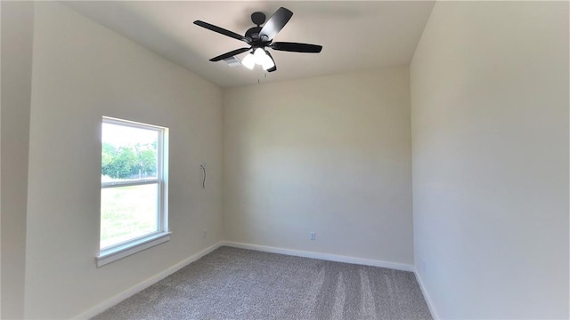 carpeted spare room with ceiling fan