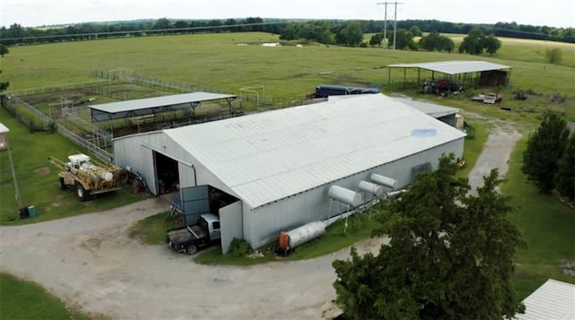 birds eye view of property featuring a rural view