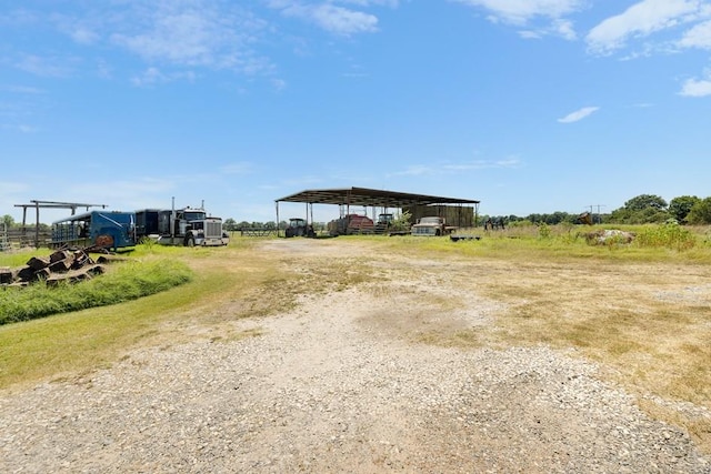 view of yard with a rural view