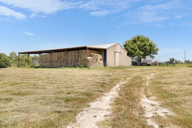 view of outdoor structure with a rural view