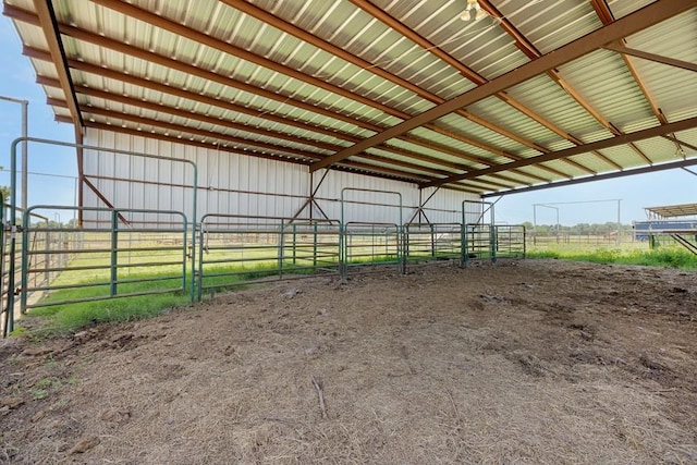 view of stable featuring a rural view