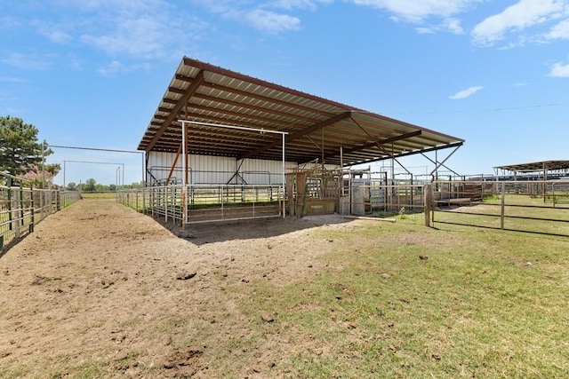 exterior space featuring a rural view and an outbuilding