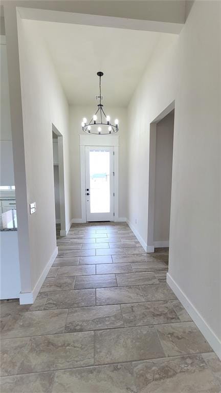 foyer entrance with a chandelier