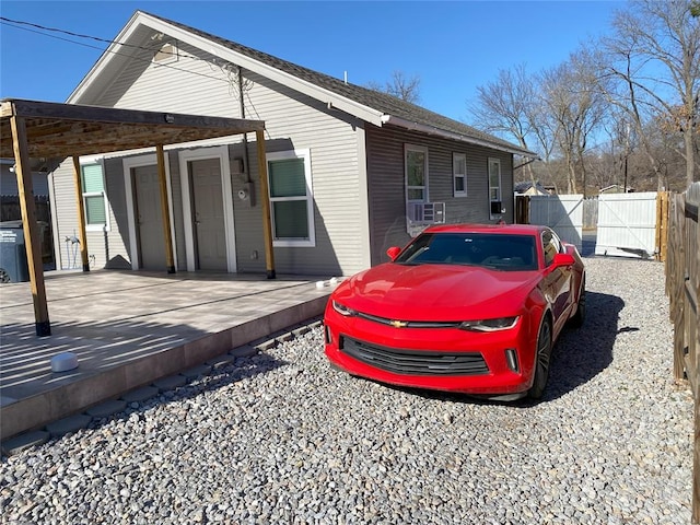 view of side of home featuring a carport