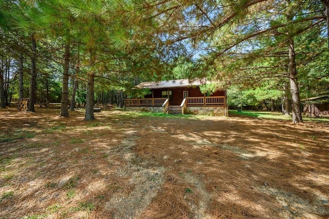 view of yard featuring a wooden deck