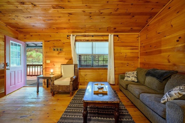 living room featuring wooden ceiling, plenty of natural light, light wood-type flooring, and lofted ceiling