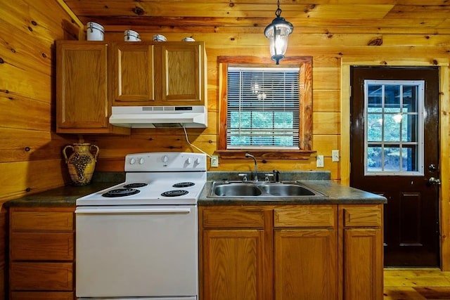 kitchen with plenty of natural light, sink, white electric stove, and hanging light fixtures