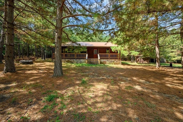 view of yard with covered porch