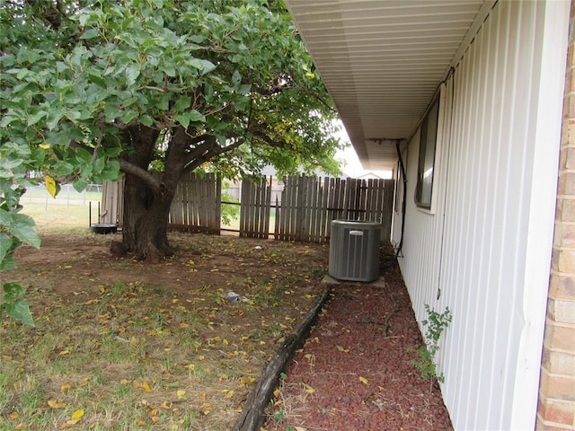 view of yard with central AC unit