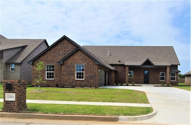 view of front of house with a front lawn and a garage