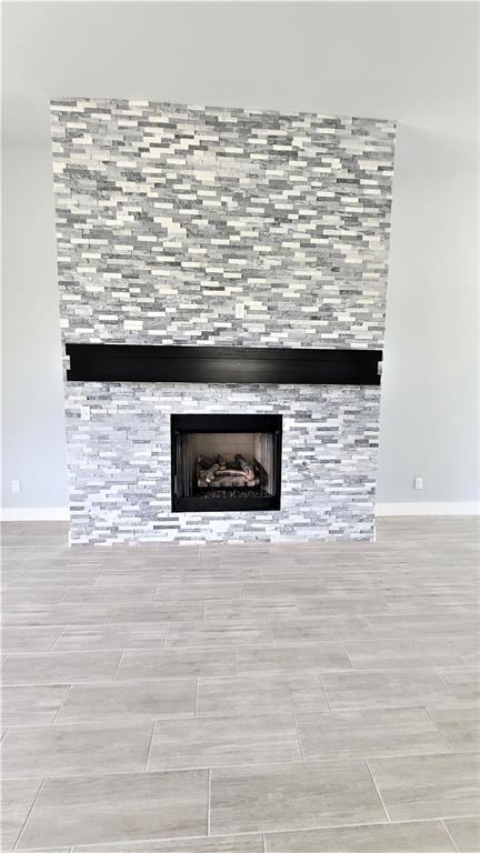 room details featuring a tile fireplace