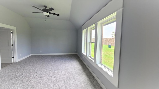 bonus room featuring ceiling fan, lofted ceiling, and light carpet