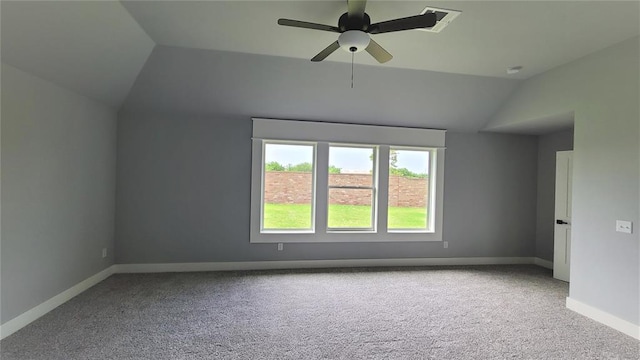 carpeted empty room featuring ceiling fan and lofted ceiling