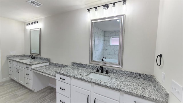 bathroom featuring hardwood / wood-style floors and vanity