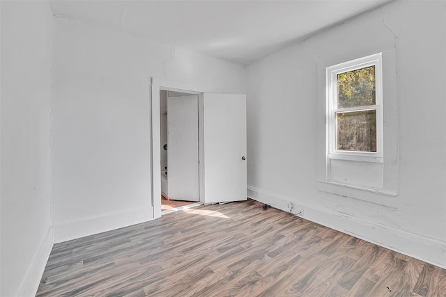 empty room featuring hardwood / wood-style flooring