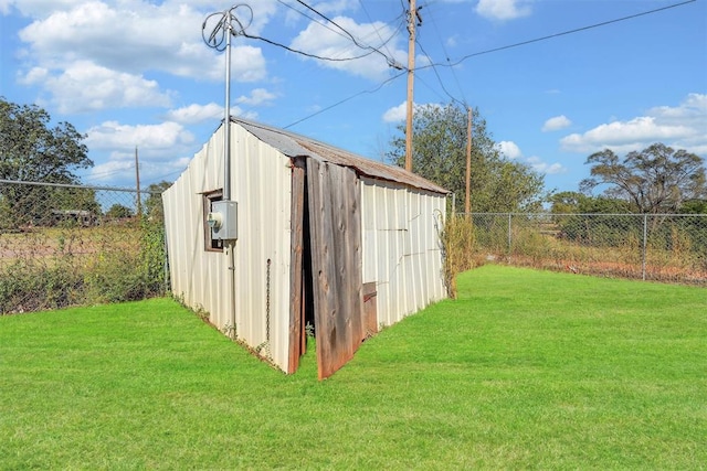 view of outdoor structure with a yard