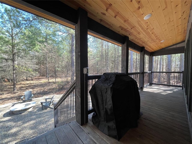 wooden terrace featuring a grill