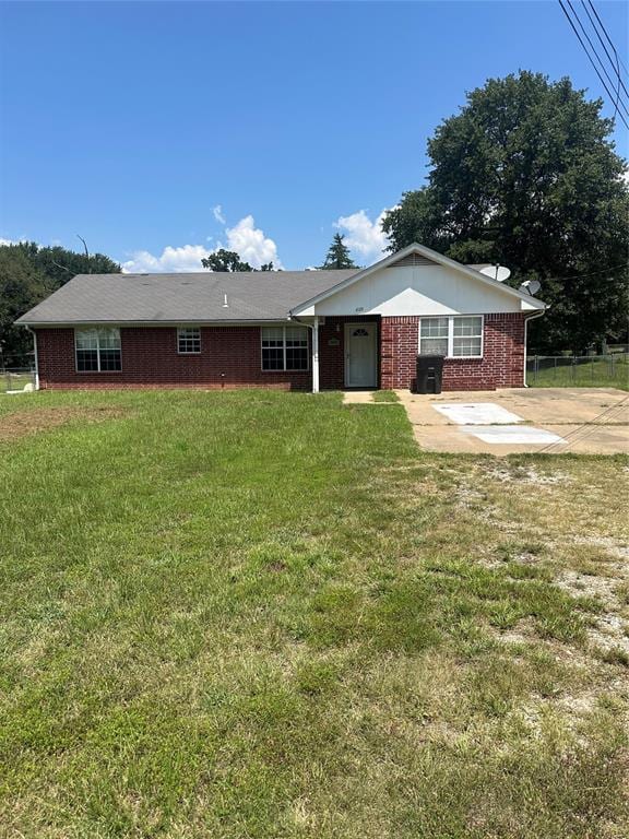 rear view of property with a yard