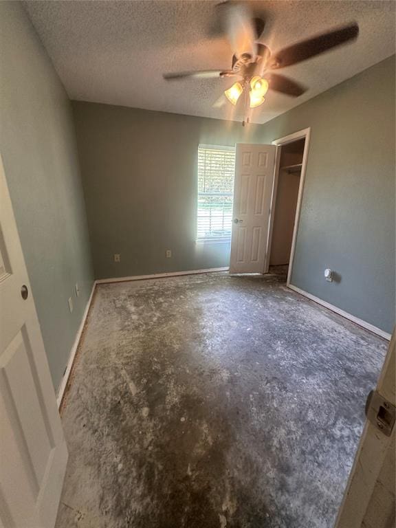 unfurnished bedroom featuring ceiling fan, a closet, and a textured ceiling