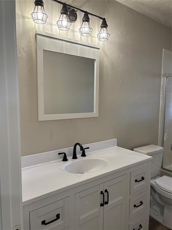 full bathroom with vanity, toilet, a textured ceiling, and shower / washtub combination