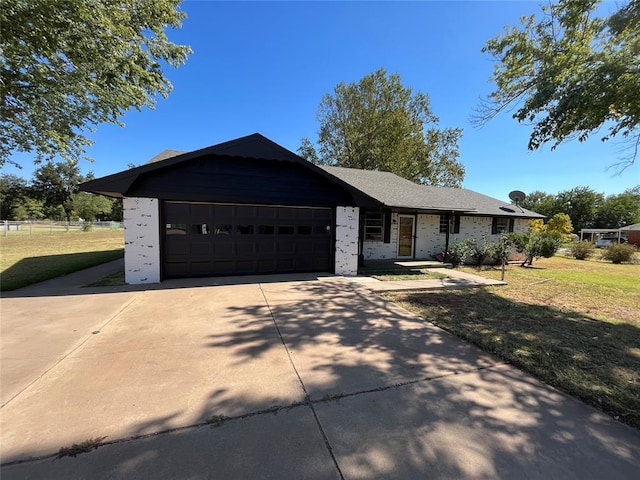 ranch-style house with a front yard and a garage