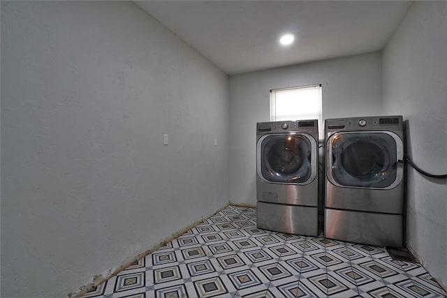 washroom featuring washing machine and dryer