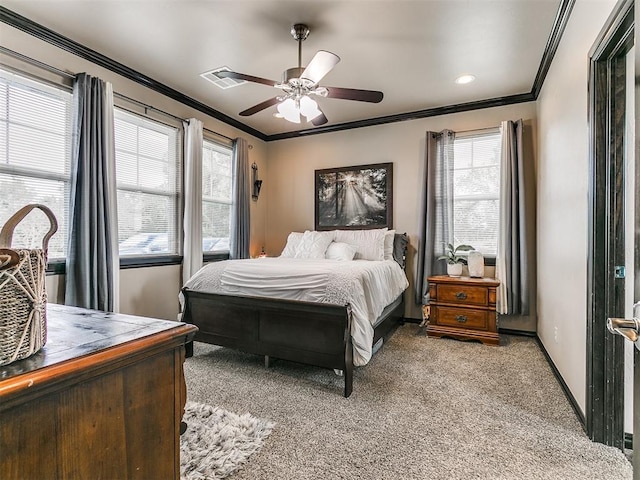 bedroom featuring multiple windows, ceiling fan, light carpet, and ornamental molding