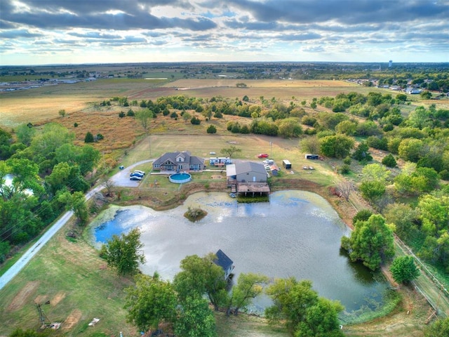 birds eye view of property with a rural view and a water view