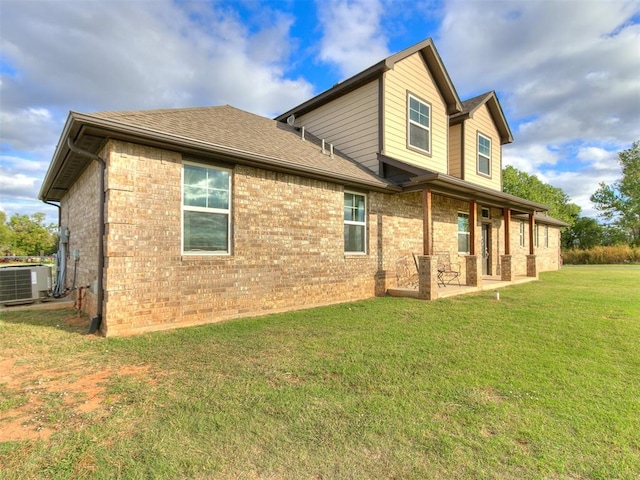 exterior space featuring a lawn, central AC, and a patio