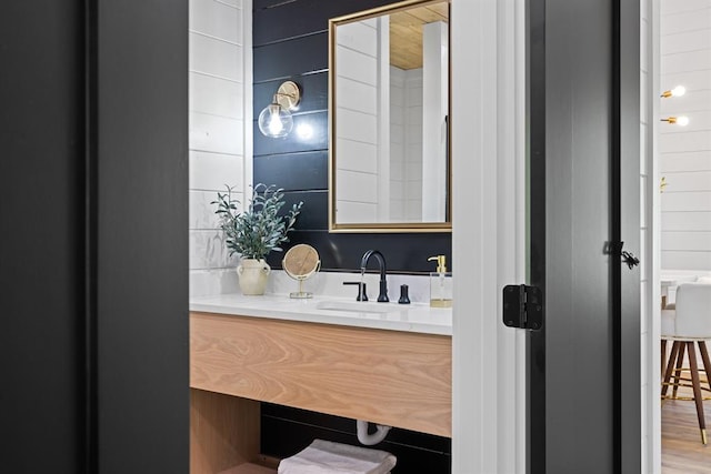 bathroom with vanity and wood-type flooring