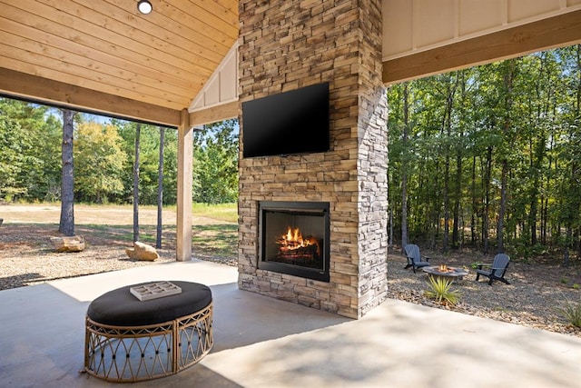 view of patio with an outdoor stone fireplace